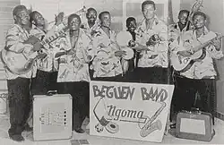 The Beguen Band (left to right) Tino Baroza, Henri Etari, André "Depiano" João, Albino Kalombo, Tchadé (holding drums), drummer Pierrot, Franc Lassan, Roitelet, and Pierre "De La France" Bazetta, ca. 1950s