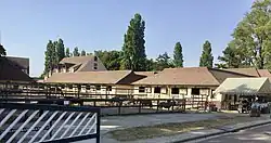 A photograph of horse stables