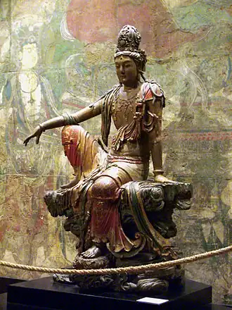 Guanyin of the Southern Seas; 11th-12th century; painted and gilded wood; height: 2.41 m; Nelson-Atkins Museum of Art (Kansas City, Missouri, US)[100]