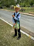 Mennonite peddler boy selling bread in Bacalar, Quintana Roo.