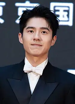 Liu in a black suit attending the Tokyo International Film Festival in 2024