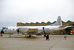 Large plane on the tarmac, with wheels chocked