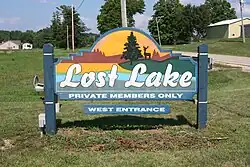 Colorful sign on grass for Lost Lake that leads into Lost Nation, Illinois, USA