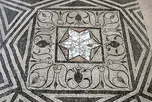 Ancient Roman star-shaped opus sectile inset within a tessellated (i.e. mosaic) pavement (Archaeological Museum, Aquileia)