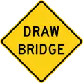A diamond-shaped with yellow background and black border, with the words "Draw Bridge"