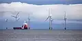 MV Vos Paradise in front of Scroby Sands wind farm
