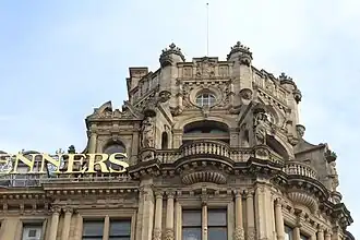 stone tower with ornate roof