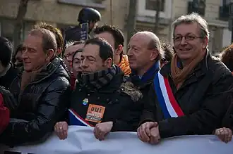 Regional councilor Jean-Luc Romero girds his scarf (2013).