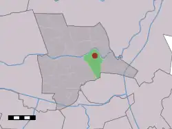 The village (dark red) and the statistical district (light green) of Junne in the municipality of Ommen.