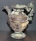 This gilded pitcher was probably used to hold perfume and was made from silver that was overlaid with gold. Much of the gold was removed from years at sea as the silver underneath corroded.