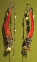 Men's ear pendants made of hornbill, discs of shell, beads and brass