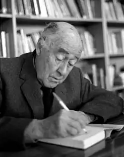 Mervyn Wall signing a book