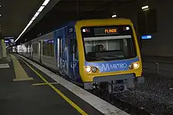 A train departing from an underground station