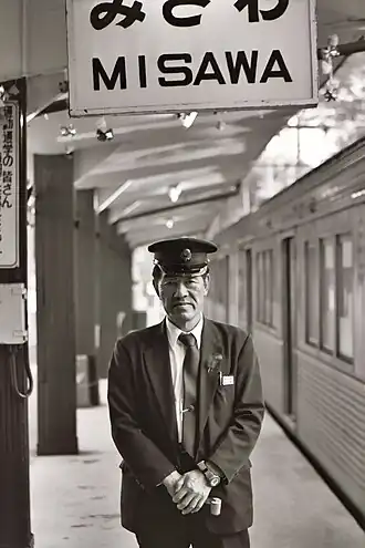 Ticket inspector on Tōtetsu platform (October 2005)