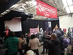 People gathered around a stage