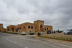 New block beside the entrance gate of the monastery housing a wine shop and small museum