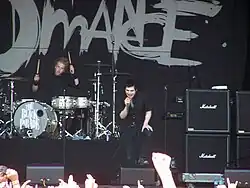 My Chemical Romance, dressed in black, onstage