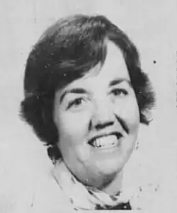 Black and white photograph of a smiling white woman