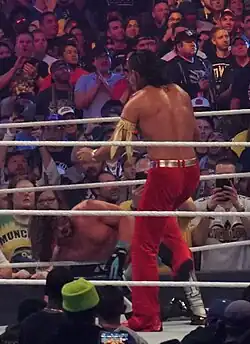 A photo of the wrestlers AJ Styles and Shinsuke Nakamura facing off at WrestleMania 34.