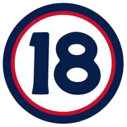 The number "18" in navy blue set against a white circle with a red and navy border