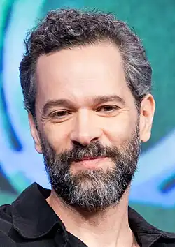 Neil Druckmann smiling at the camera