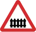B41: Railway level crossing ahead with gate or barrier