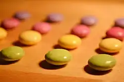 Sweets sorted by colour and aligned in rows and columns