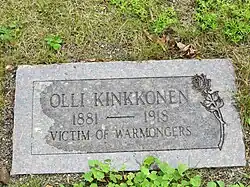 Photo of headstone, which reads "Olli Kinkkonen, 1881–1918, victim of warmongers"