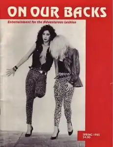 Magazine cover with On Our Backs in white text on a red background as well as a black-and-white photograph of two women.