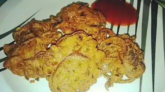 Onion fritters (piyaji) is a Bengali dish made with onions.