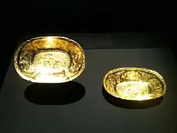 Two Tang oval-lobed gold bowls, each decorated with two ducks in repoussé amidst chased flowers