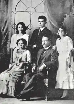 A black-and-white photograph of a family of five