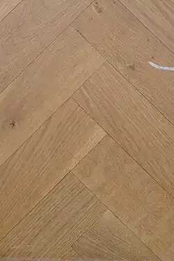 Close up of a parquet with herringbone pattern
