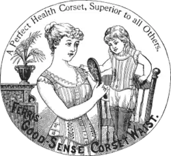 An advertisement for the "Perfect Health Corset". A woman in a corset shows a young girl, also wearing a corset, her reflection in the mirror.