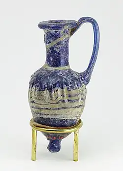 Perfume vase in shape of an amphoriskos; 664–630 BC; glass: 8 cm × 4 cm (3.1 in × 1.6 in); Metropolitan Museum of Art