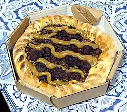 Chocolate brownie and dulce de leche pizza, with dulce de leche-filled soft crust