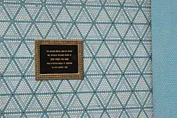 A plaque on a wall of a mosque