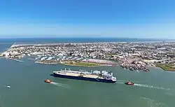 LNG carrier ship passing by the channel