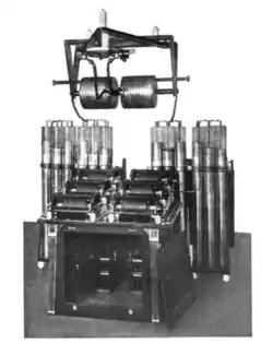 A powerful quenched-spark transmitter in Australia. The 6 cylinders in front of the Leyden jars are the quenched spark gaps.