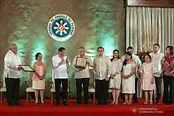 President Rodrigo Duterte posthumously confers the Quezon Service Cross to Miriam Defensor-Santiago at the Malacañan Palace on December 3, 2018. Accepting the award is Santiago's husband, Narciso Santiago, Jr.