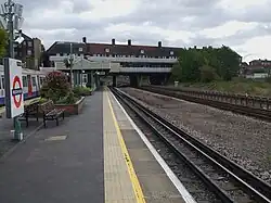 Northbound platform looking east with an A Stock on the southbound platform. The Wembley Stadium arch is visible on the right in the background.