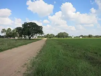 A north-looking view of the area shows the old hotel behind the oak tree at left.