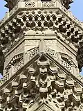 Detail of the stone carving and muqarnas on the minaret