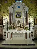 Main altar showing the marble detail and gold mosaic.