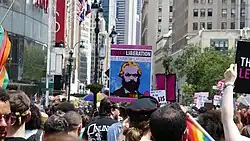 A Marxist sign reading "Queer Liberation, Not Rainbow Capitalism" in 2019