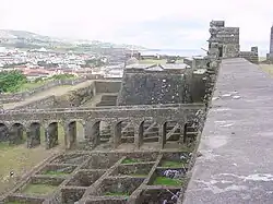 A system of wolf holes in front of the walls of a medieval castle (Portugal, May 2007)