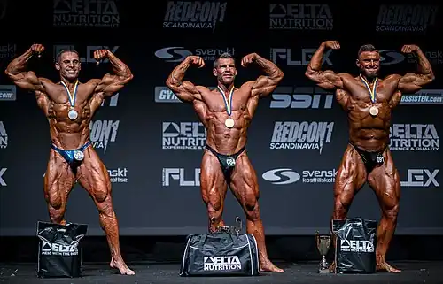 Bodybuilders who have been spray tanned