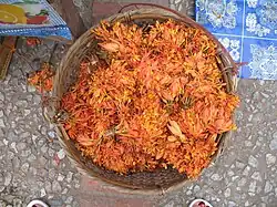 Flowers for use in cooking sold in a market in Laos.
