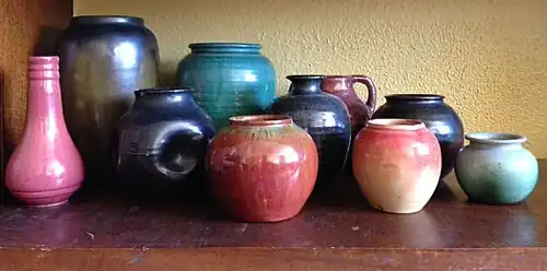 Various undecorated Newcomb College Pottery pieces showing a variety of forms