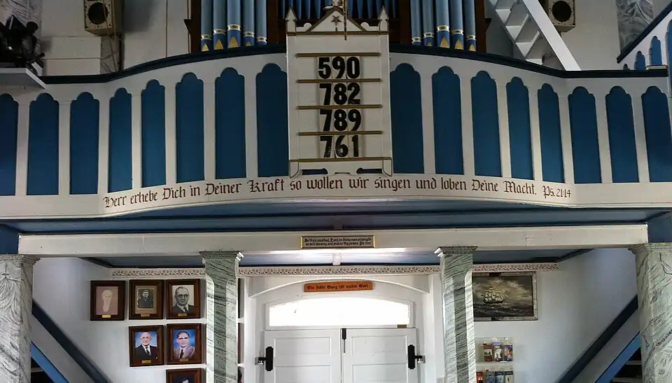 Interior of the church, facing the rear, showing the Bible verse in German, not Wendish/Sorbian